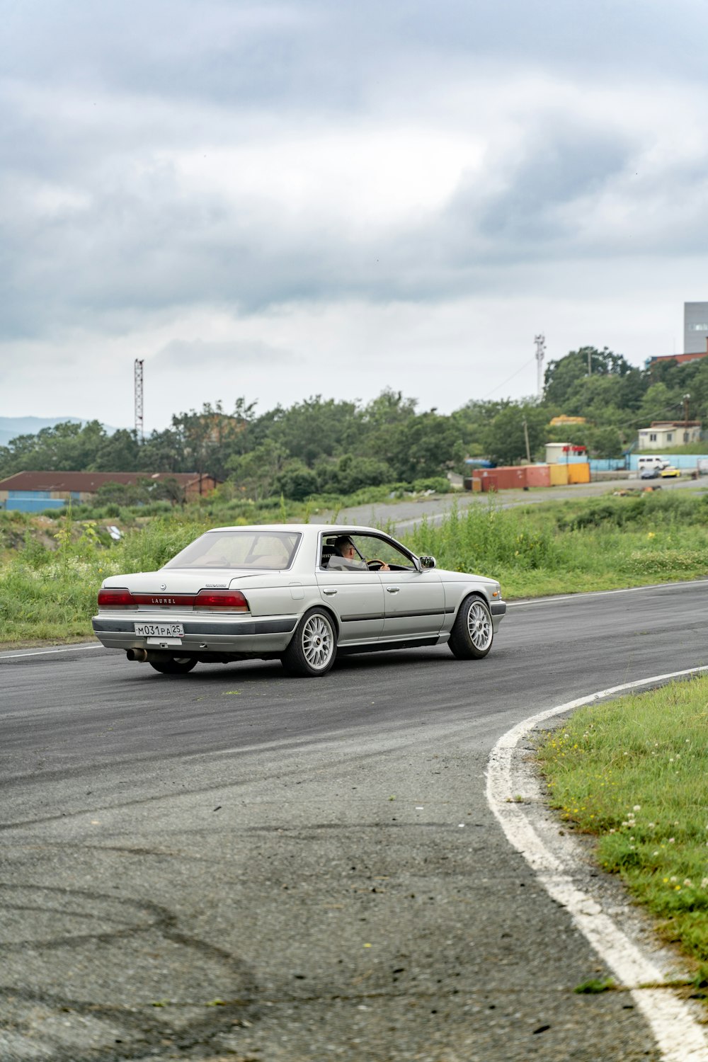 red coupe on road during daytime