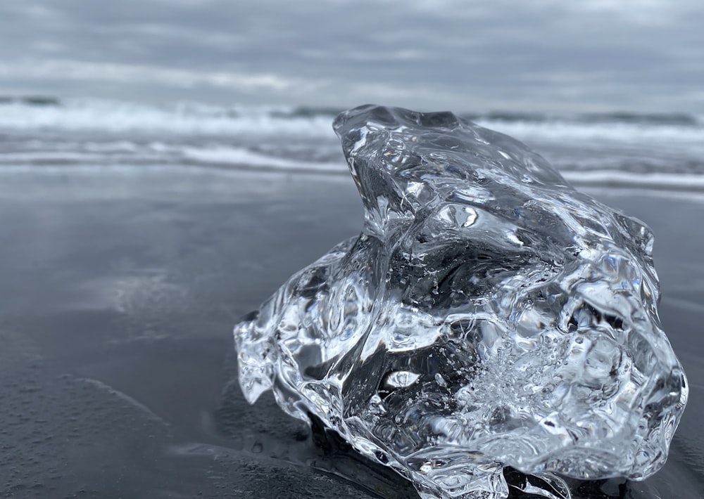 clear crystal on gray sand