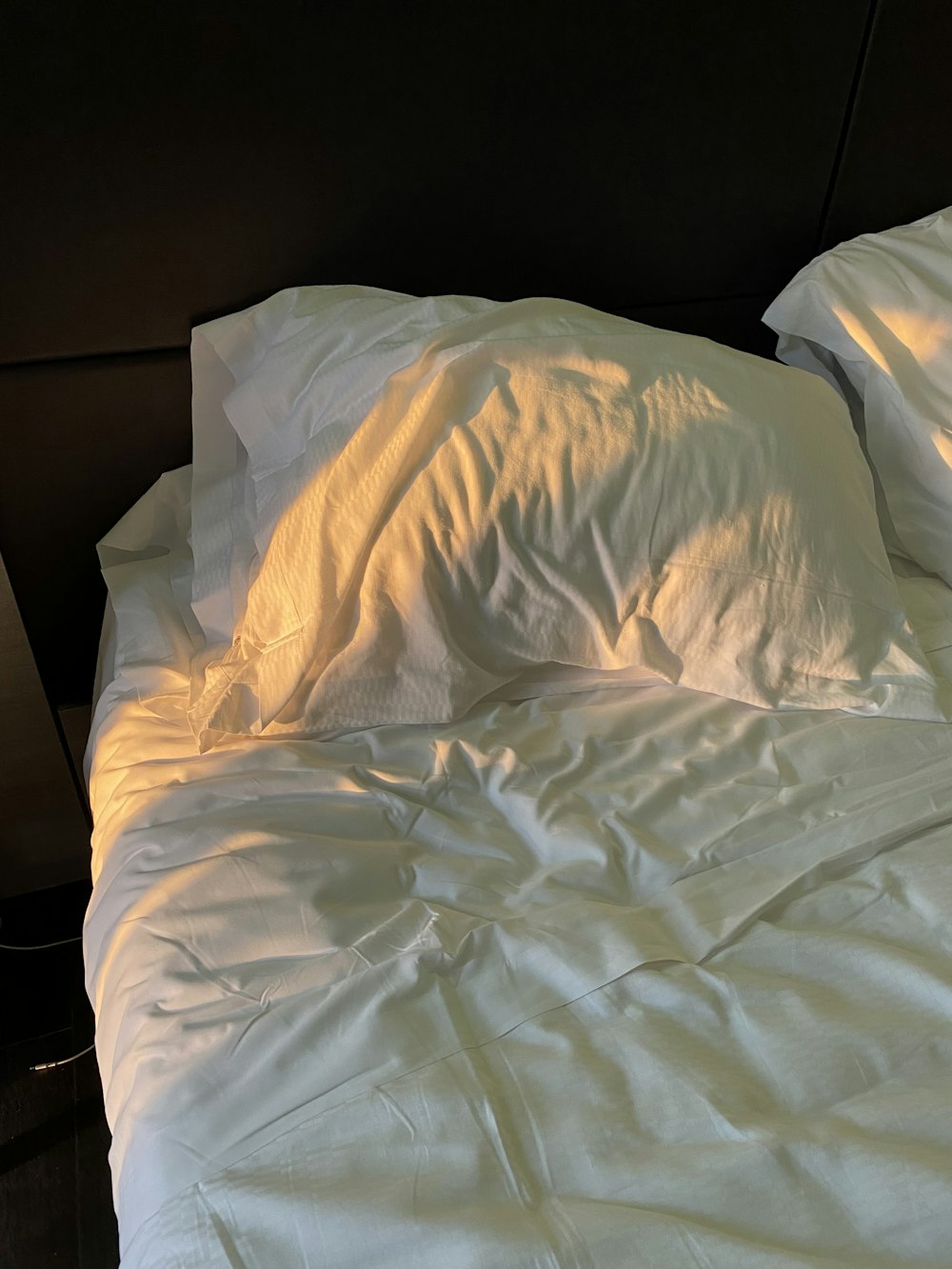 white textile on white bed