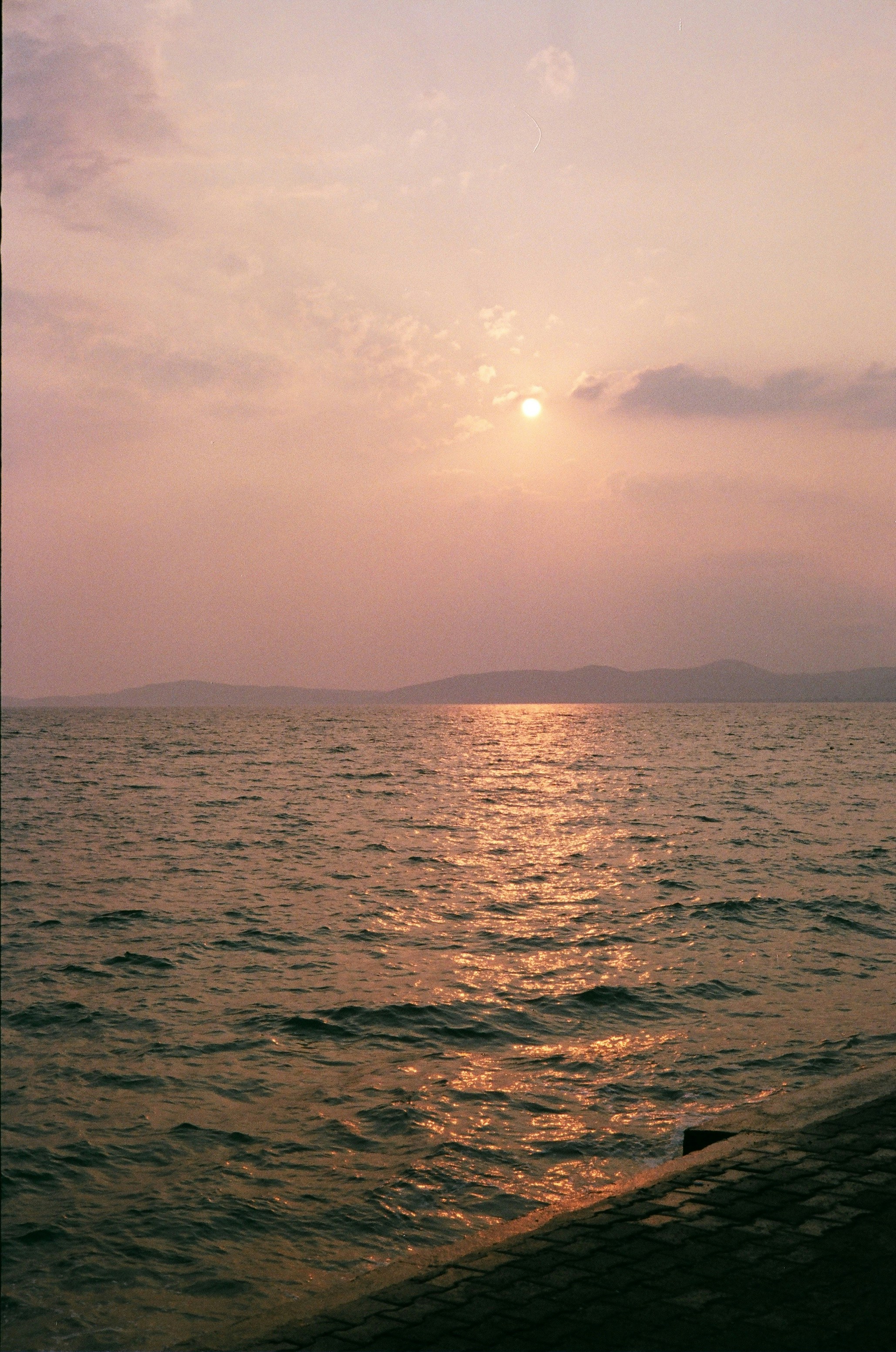 body of water under cloudy sky during daytime