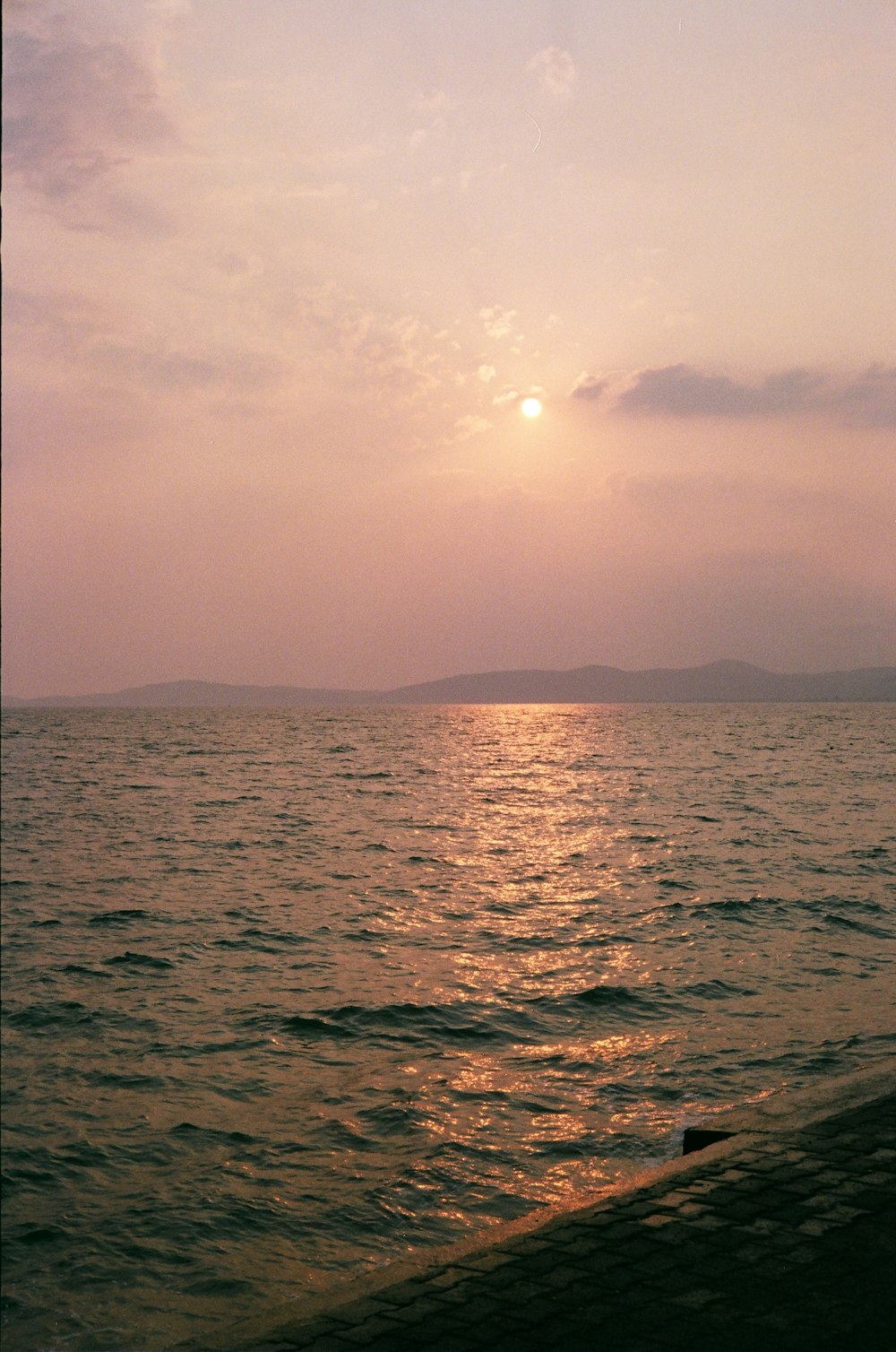 body of water under cloudy sky during daytime