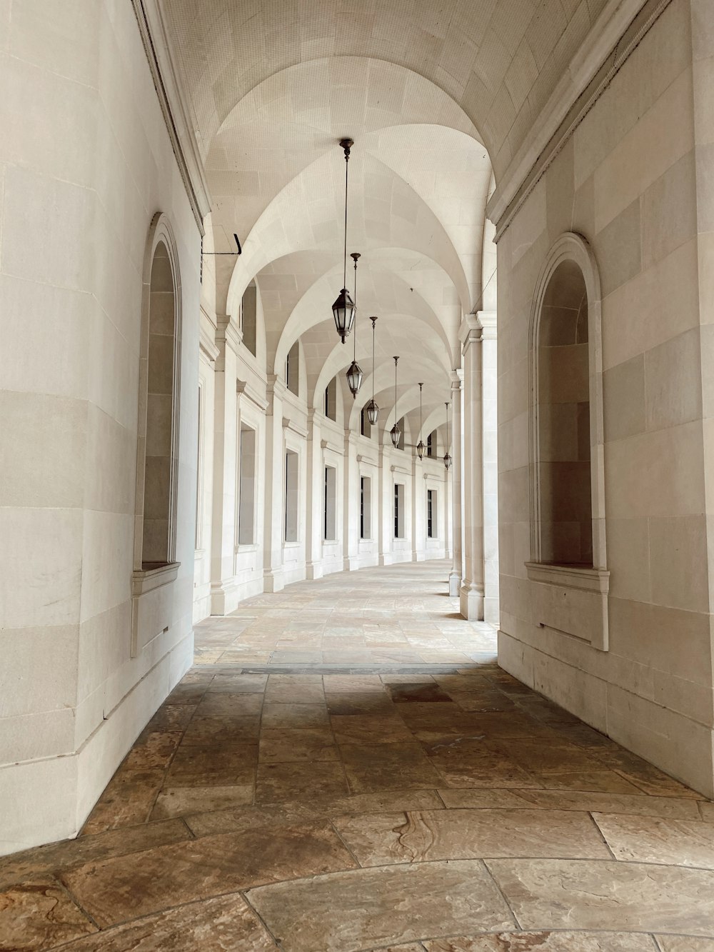 white and brown concrete hallway