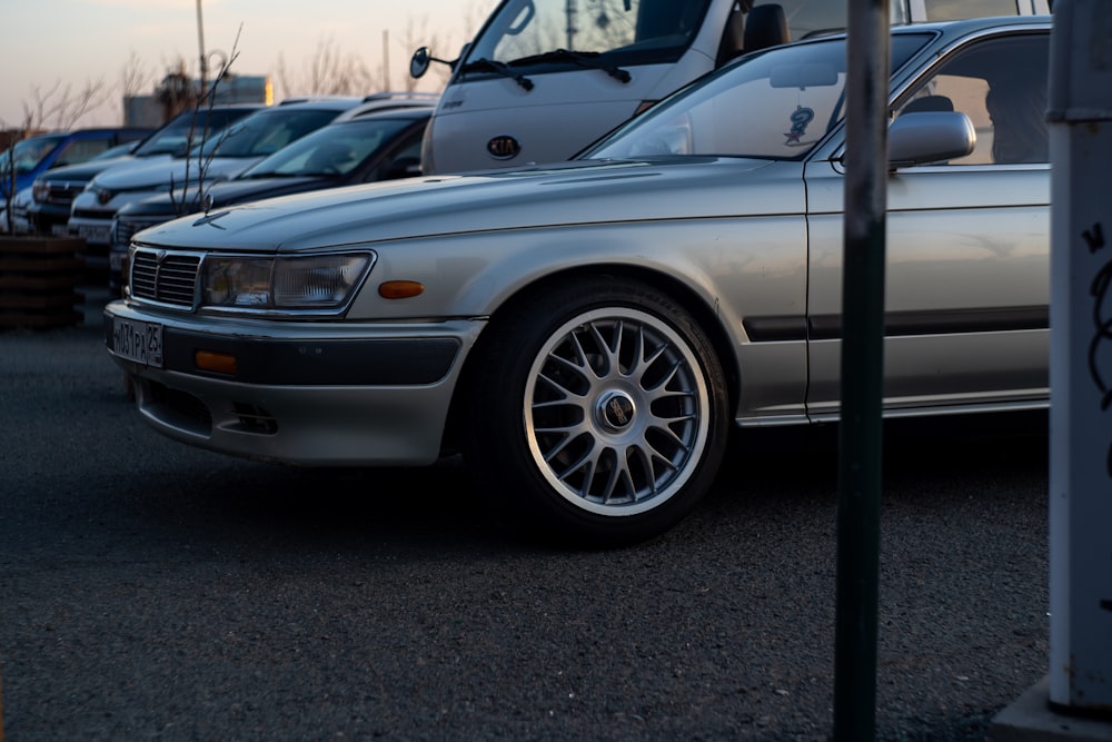 silver car parked on parking lot during daytime