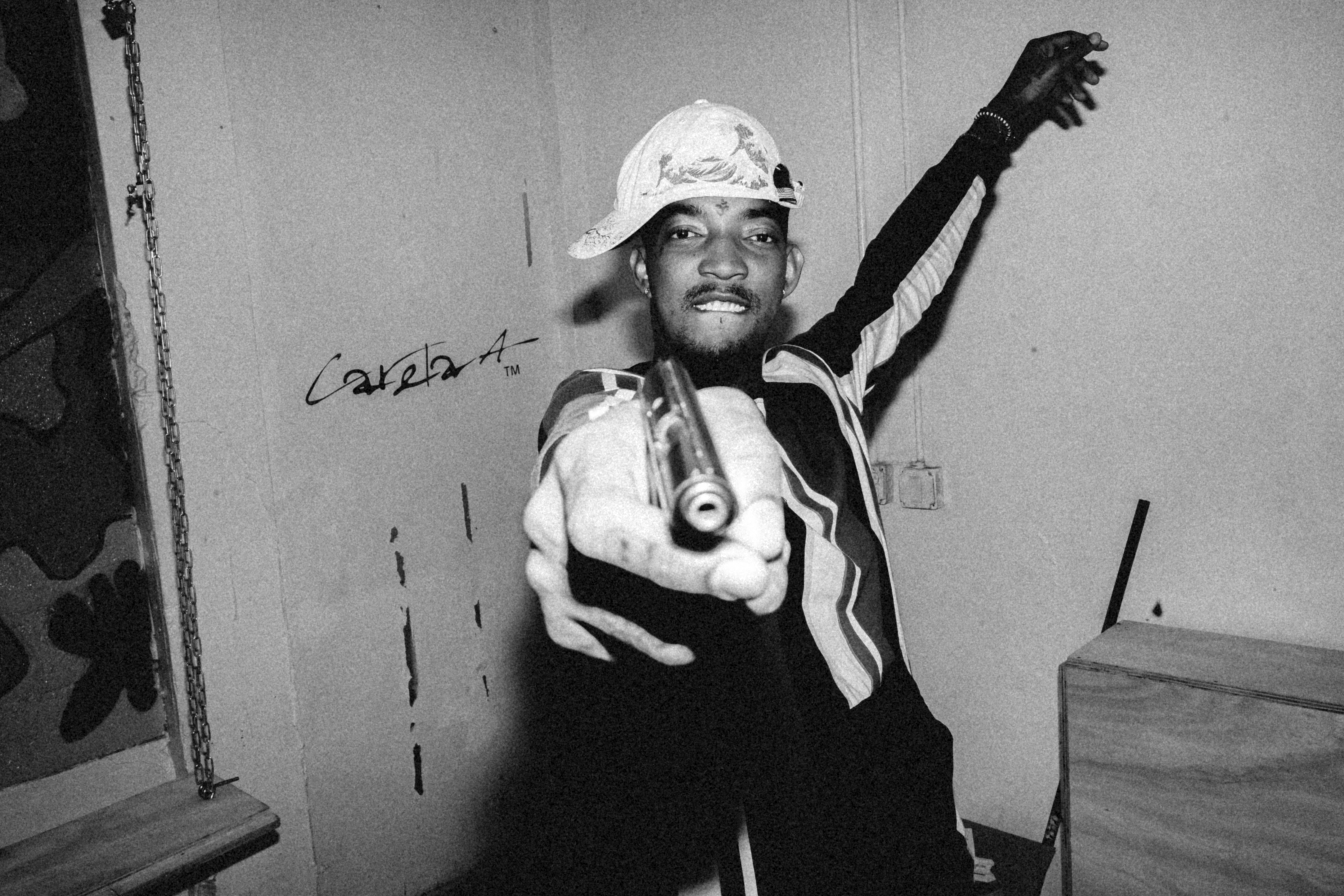 man in black long sleeve shirt holding gun