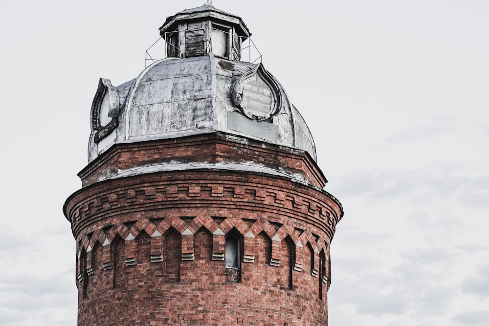 brown brick building under white sky