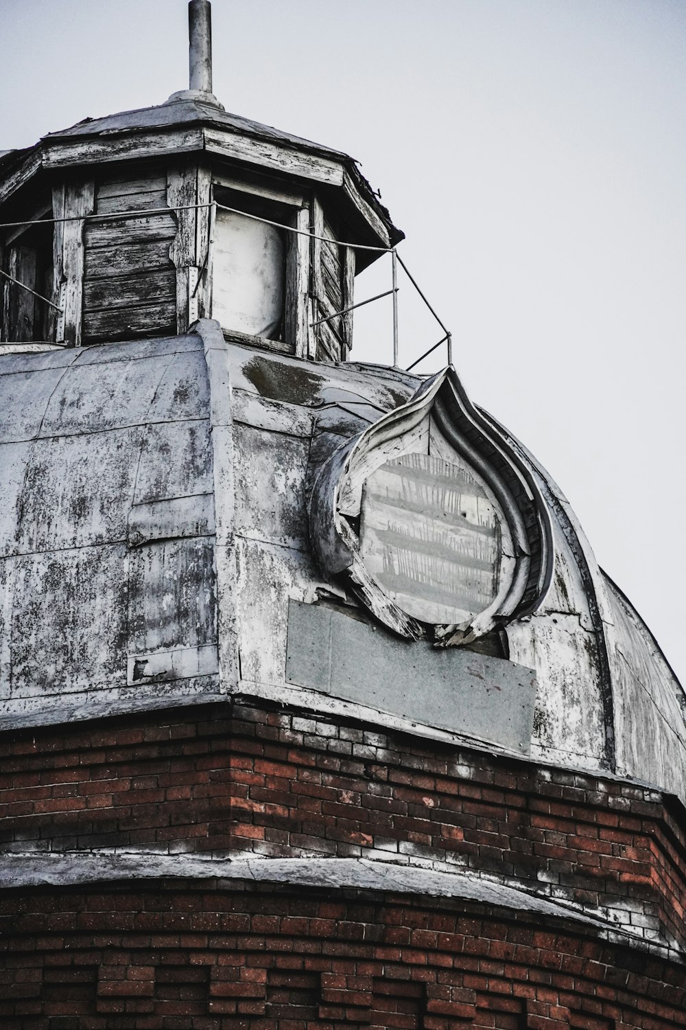 gray concrete building with red roof