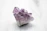 purple crystal on white table