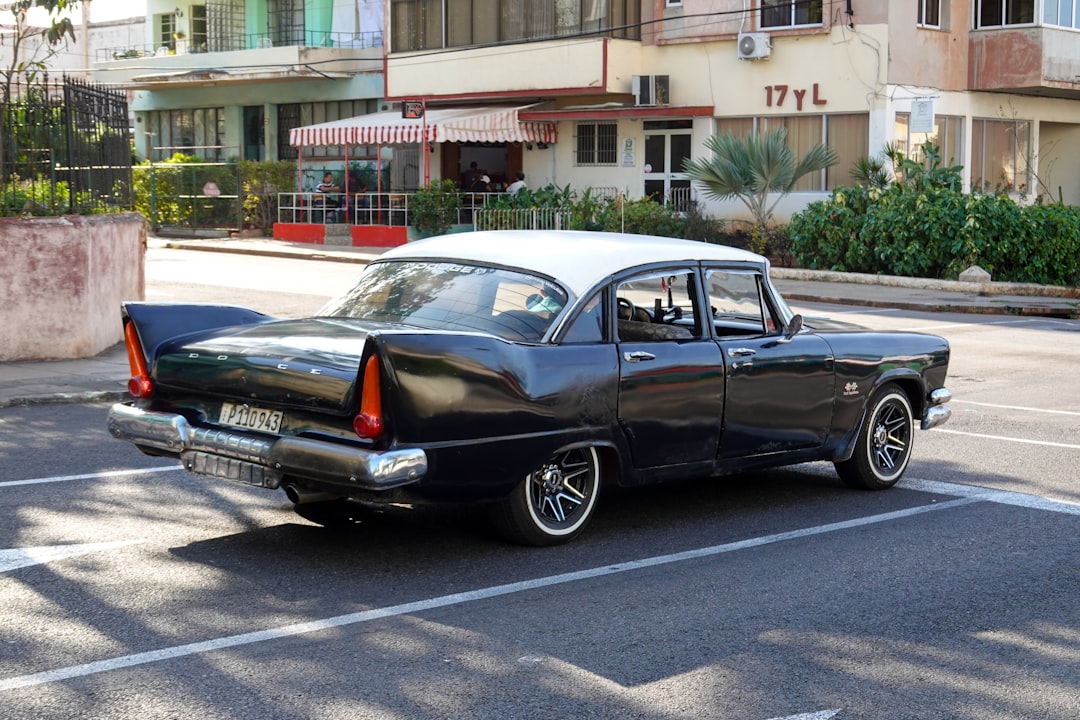 black sedan on road during daytime