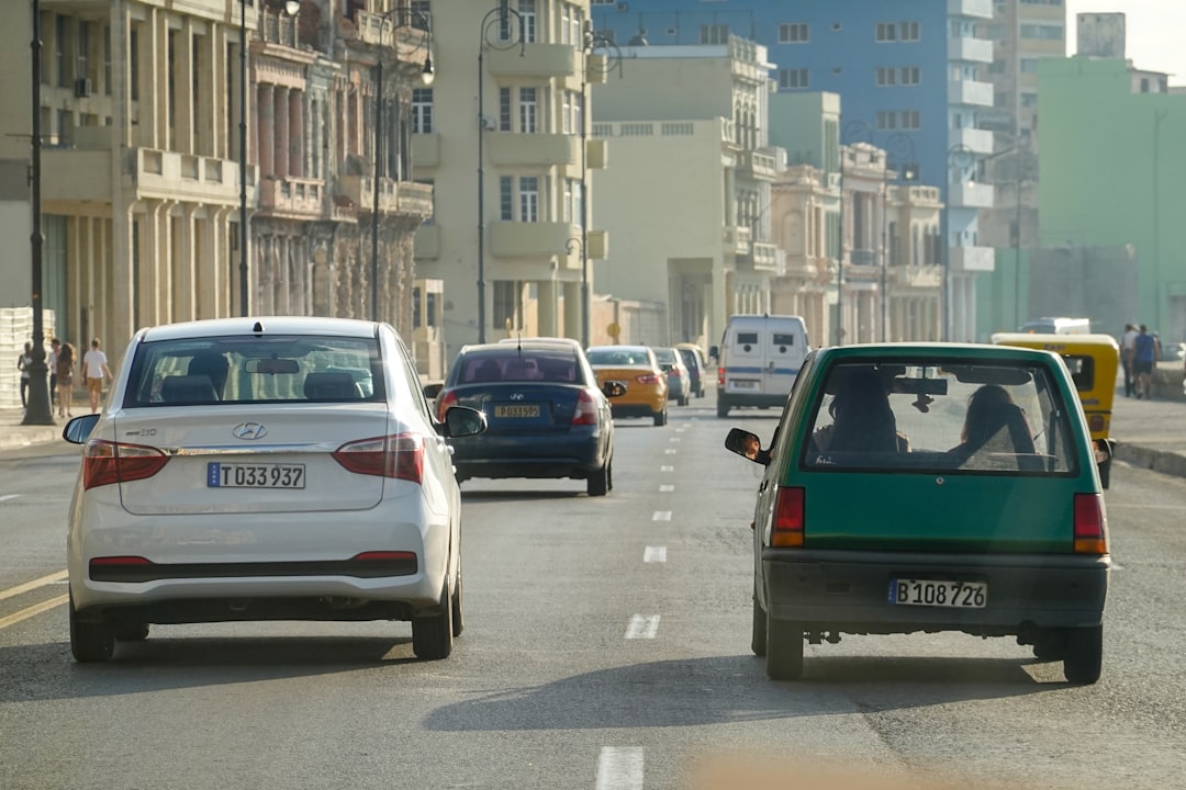 white and black car on road during daytime