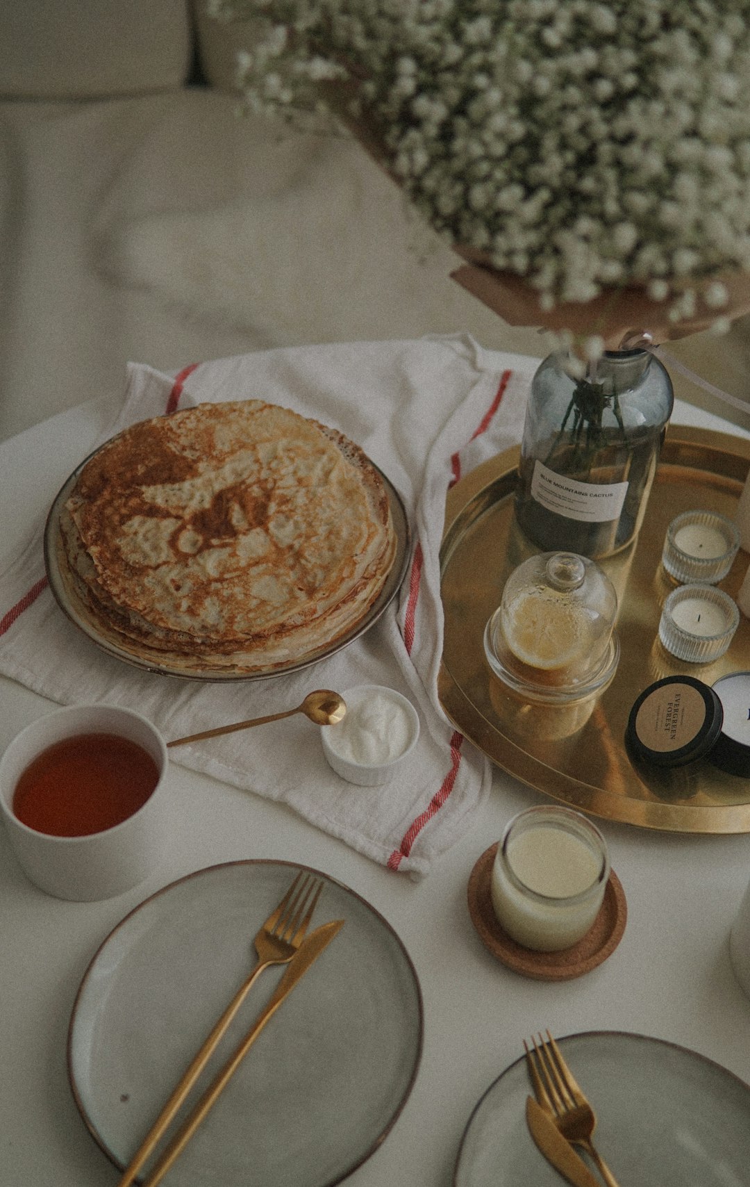 brown and white ceramic round plate on white table cloth