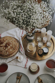 A cheerful morning scene with a pastel-themed breakfast setup and fresh flowers.
