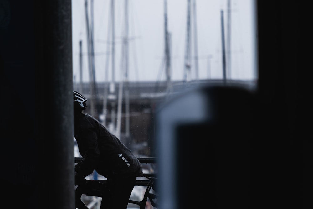 man in black jacket riding bicycle