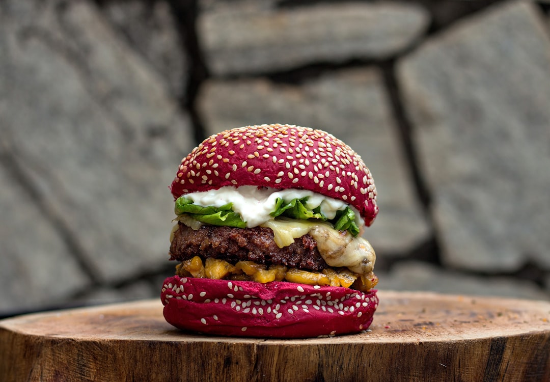 burger on brown wooden chopping board