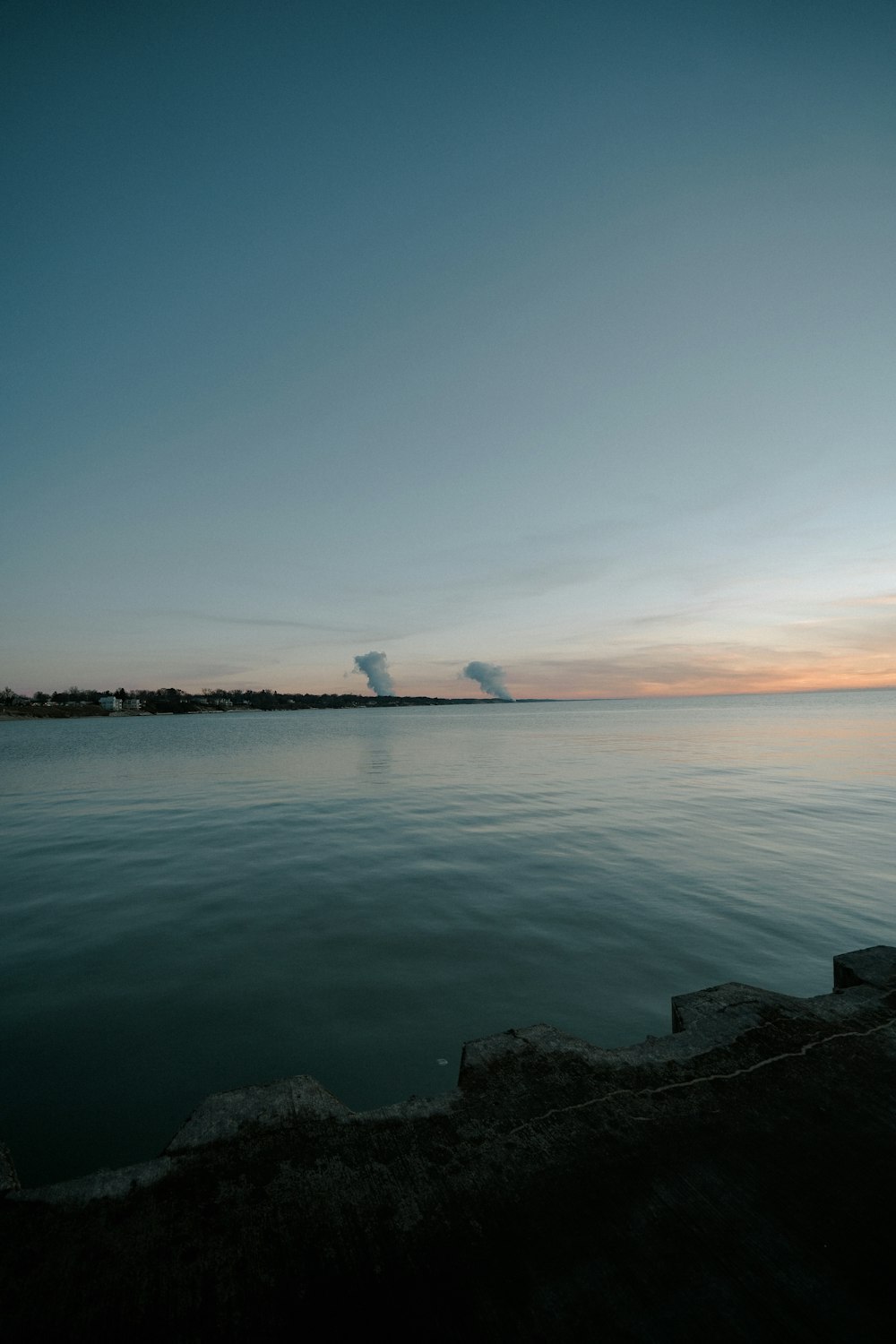 body of water under blue sky during daytime