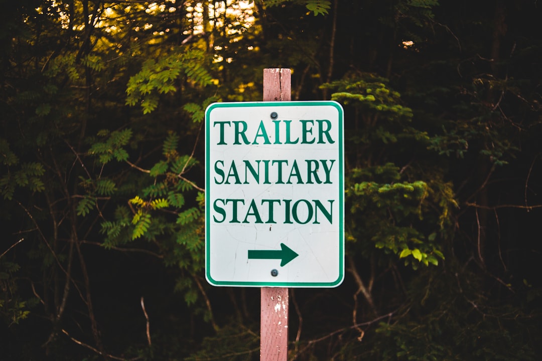 green and white wooden signage