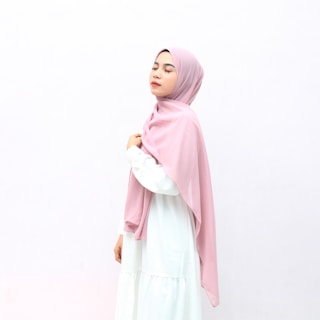 woman in pink hijab and white long sleeve dress