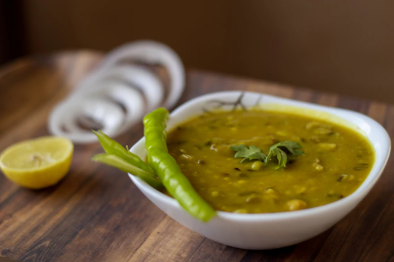A bowl of masoor dal tadka with a swirl of ghee