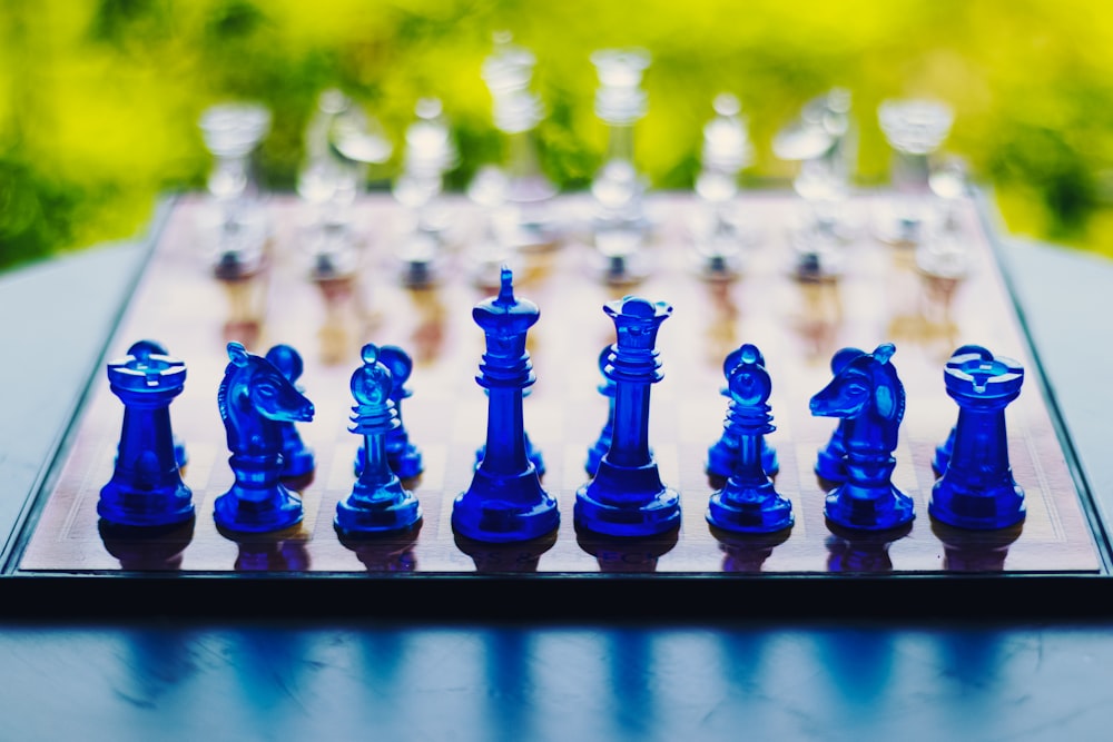 blue chess piece on black metal fence