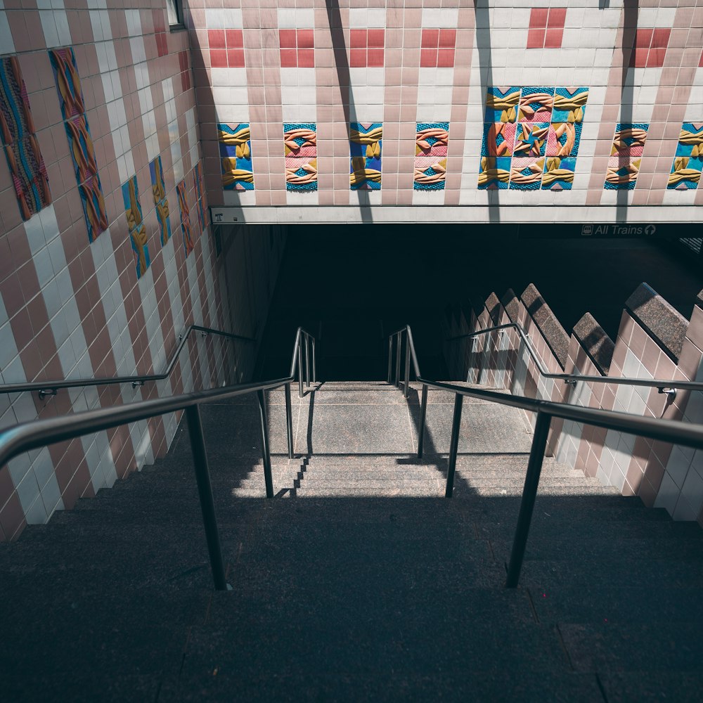 black metal railings near white and brown concrete building