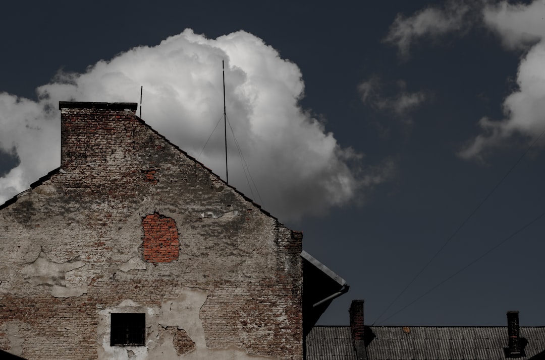 brown brick building under gray sky