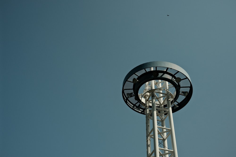 gray metal tower under blue sky