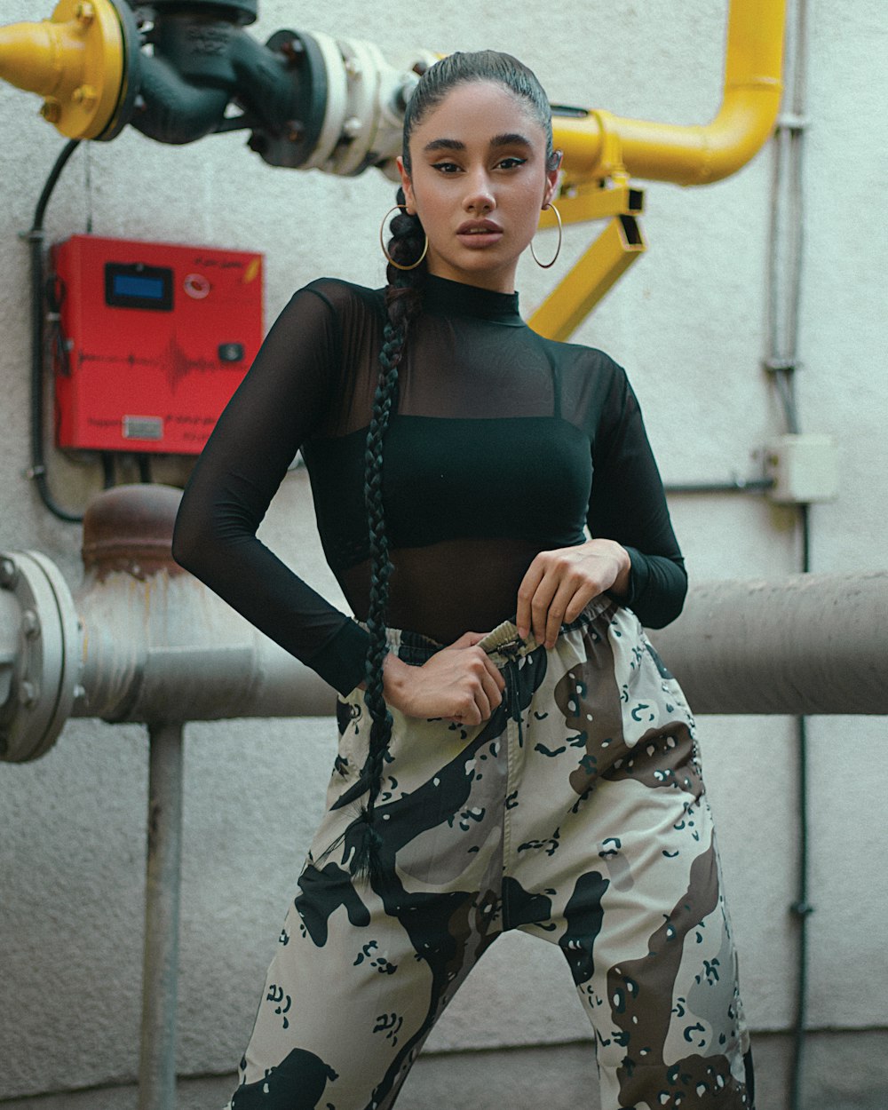 woman in brown and black long sleeve shirt and black pants