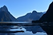 body of water near mountains during daytime