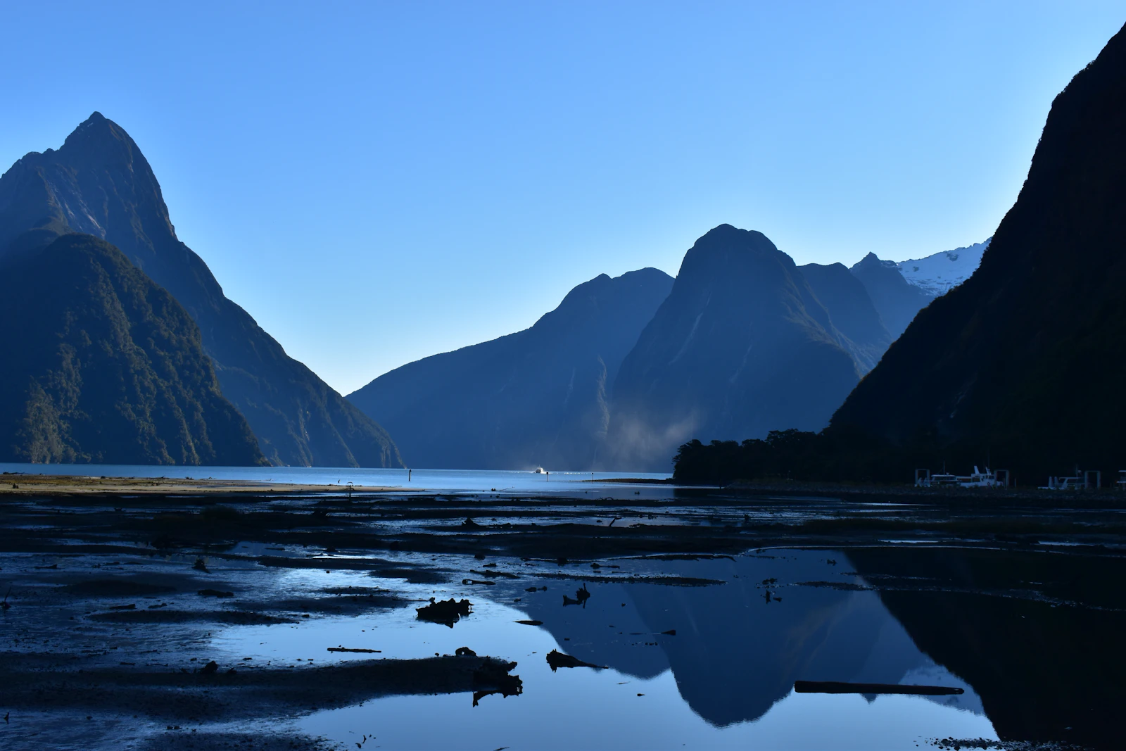 A lake below snow-capped mountains in the lower South Island of New Zealand