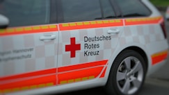 white and orange car on road