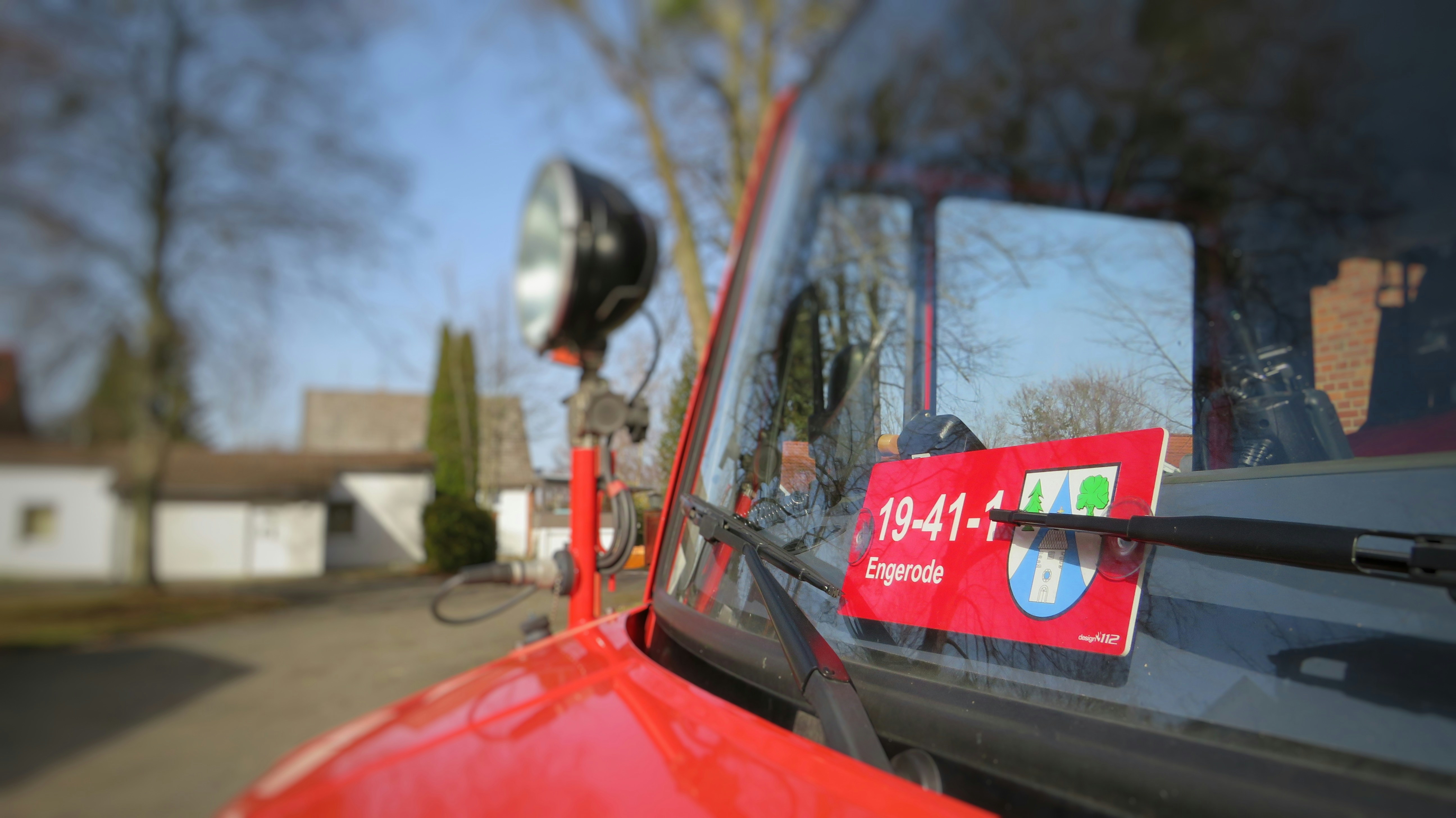 red car with black and white helmet
