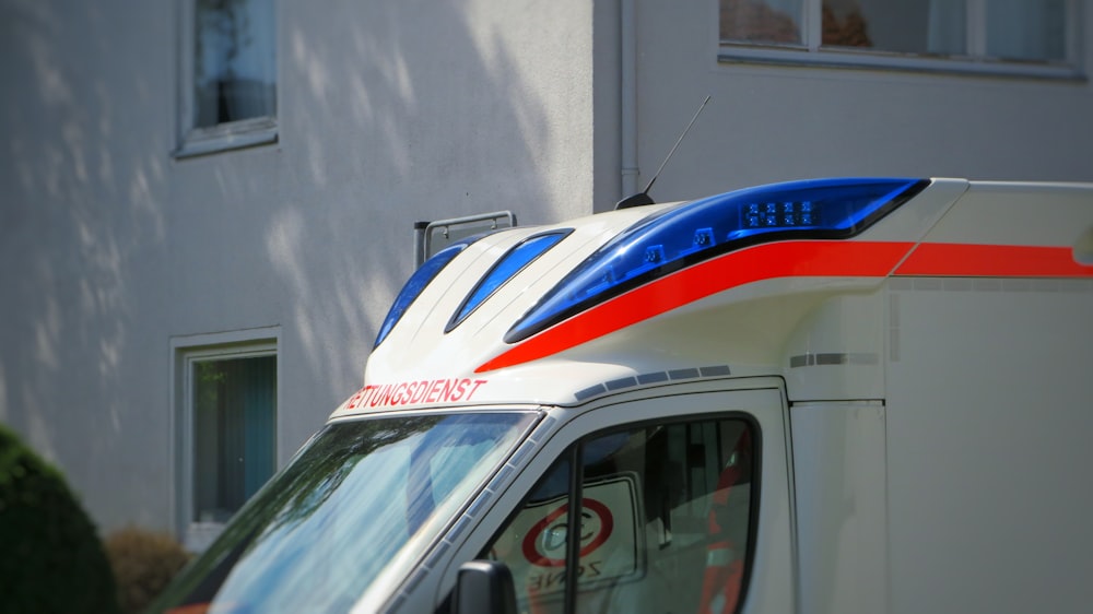 white and red van on road