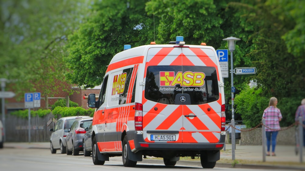 white red and blue van on road during daytime