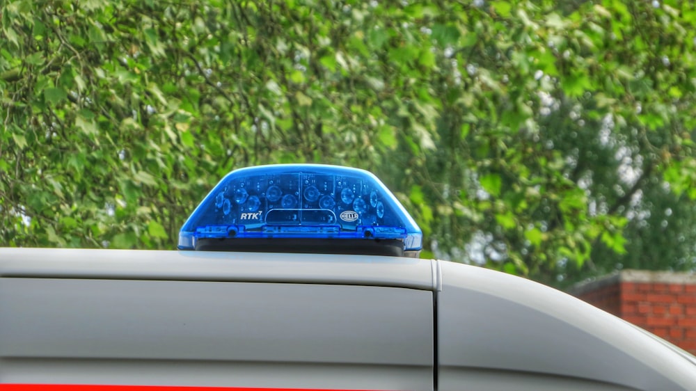 blue car parked on the side of the road