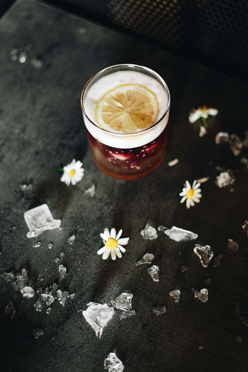 clear drinking glass with brown liquid