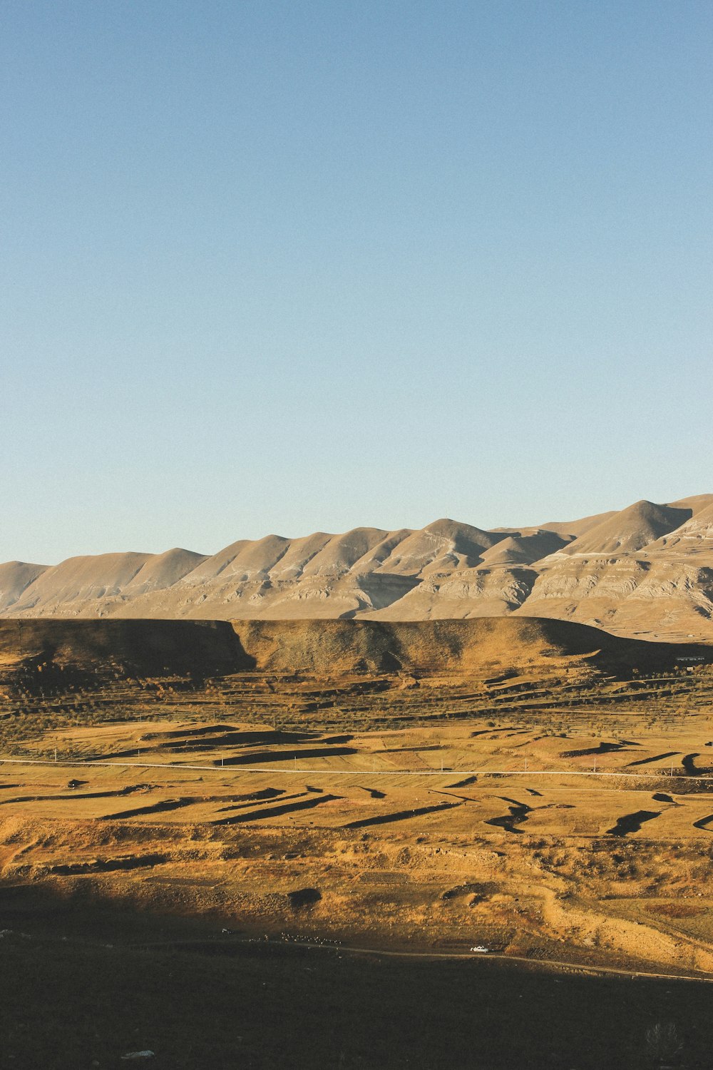 brown mountain under blue sky during daytime