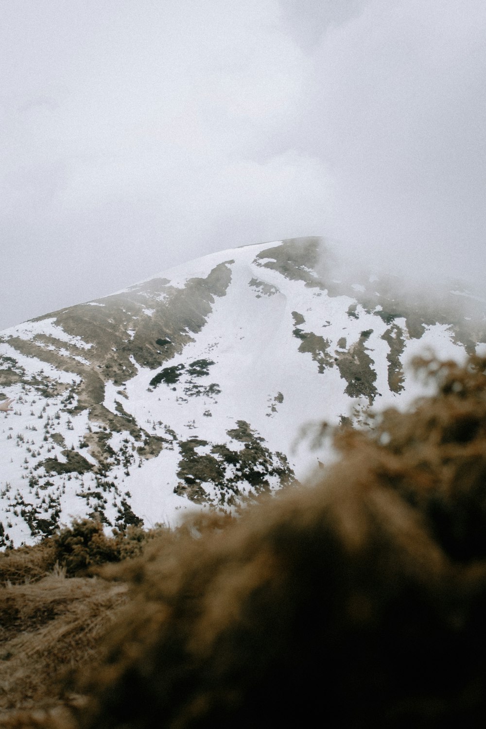 snow covered mountain during daytime