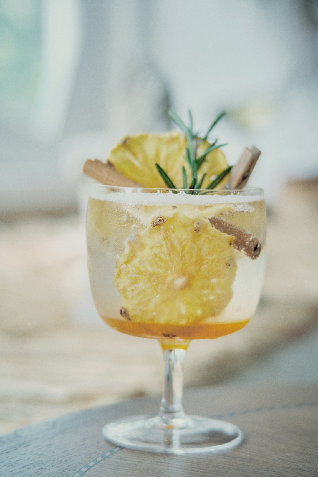 clear wine glass with yellow liquid