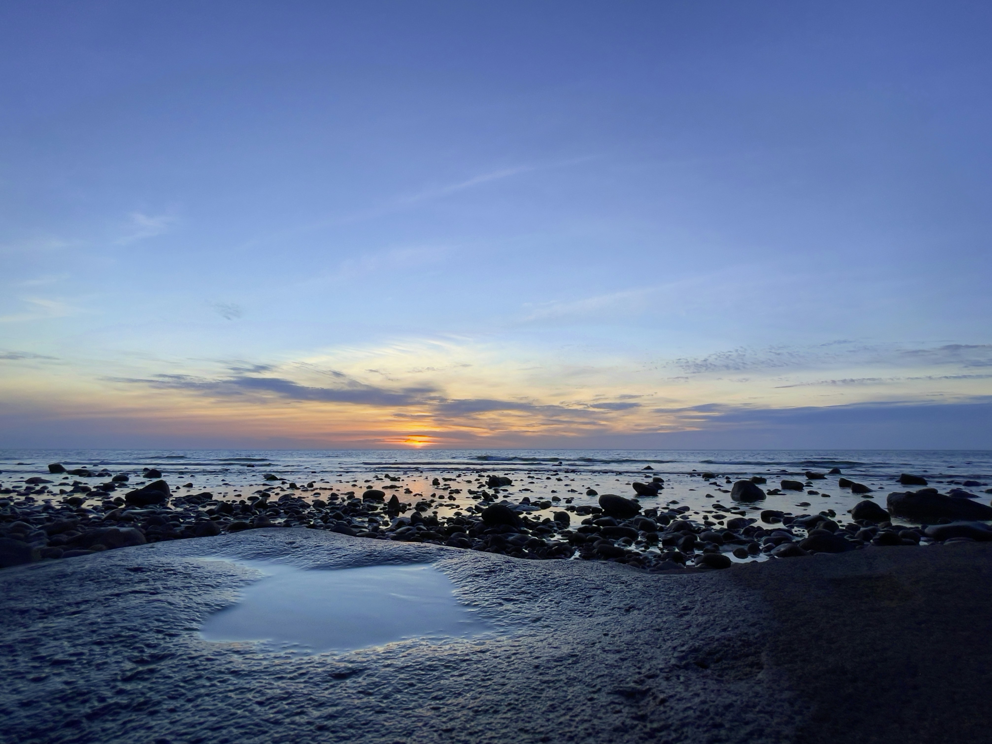 Taiwan coastline at sunset with calm water