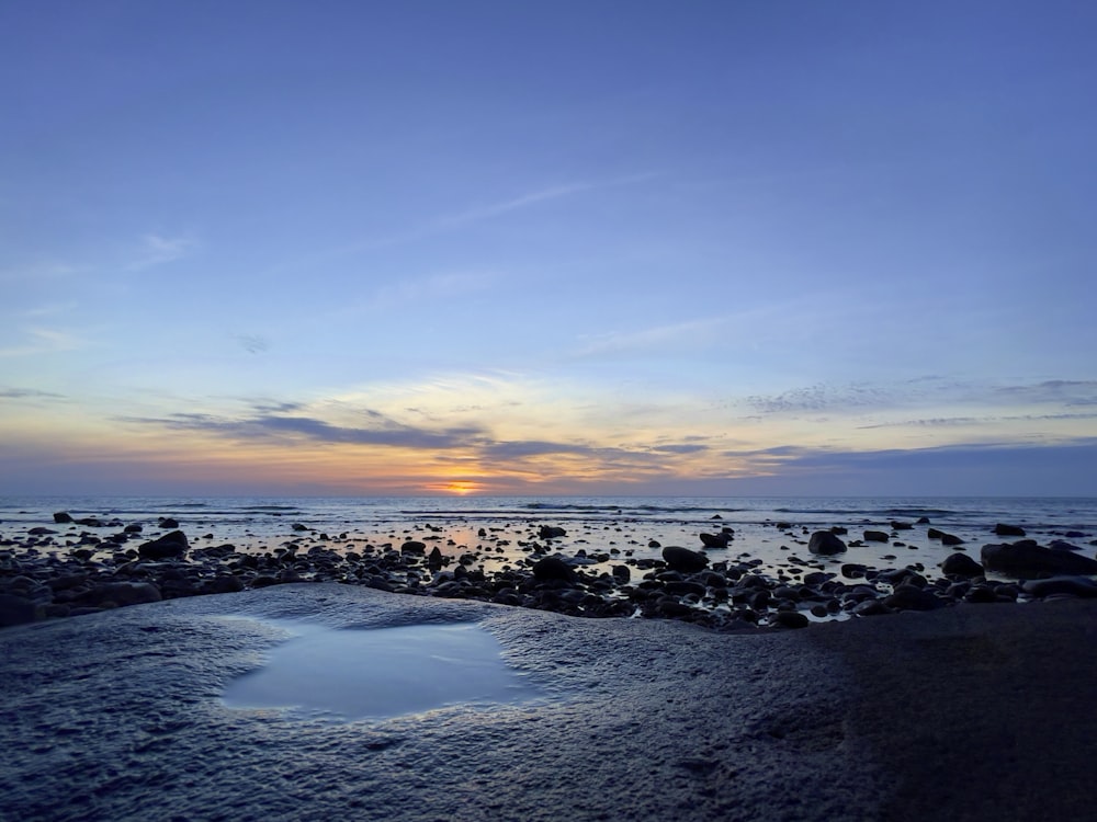 body of water under blue sky during daytime