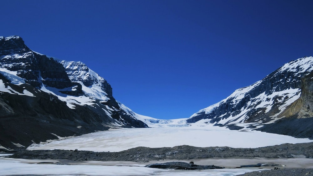 snow covered mountain under blue sky during daytime