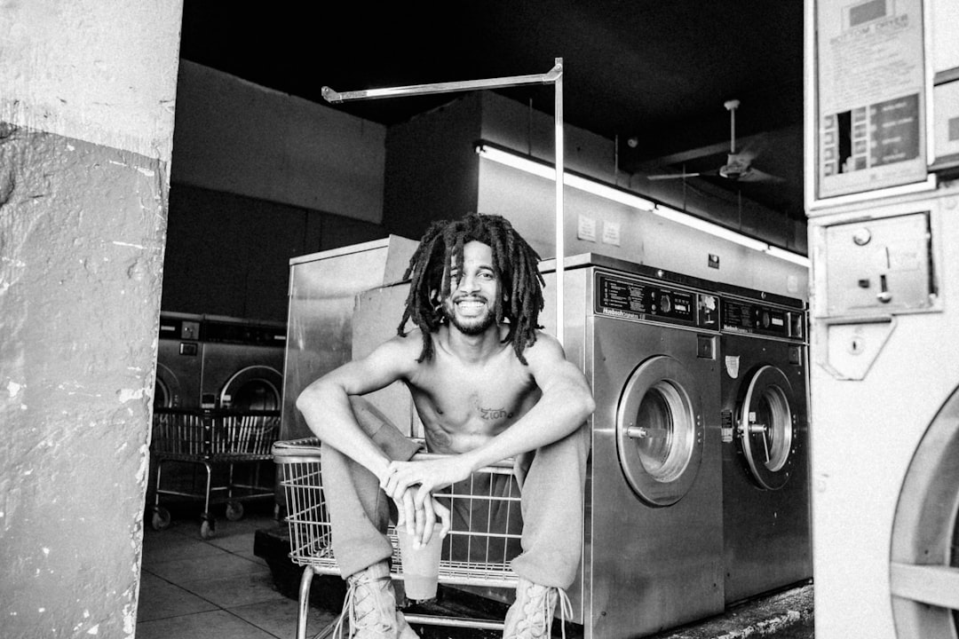 naked woman in front of washing machine