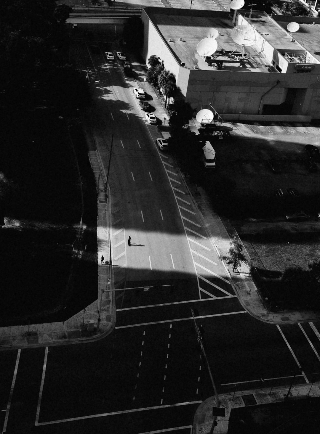 grayscale photo of cars on road