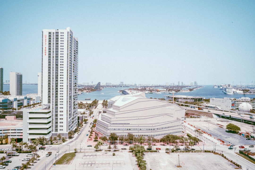 white high rise buildings near body of water during daytime