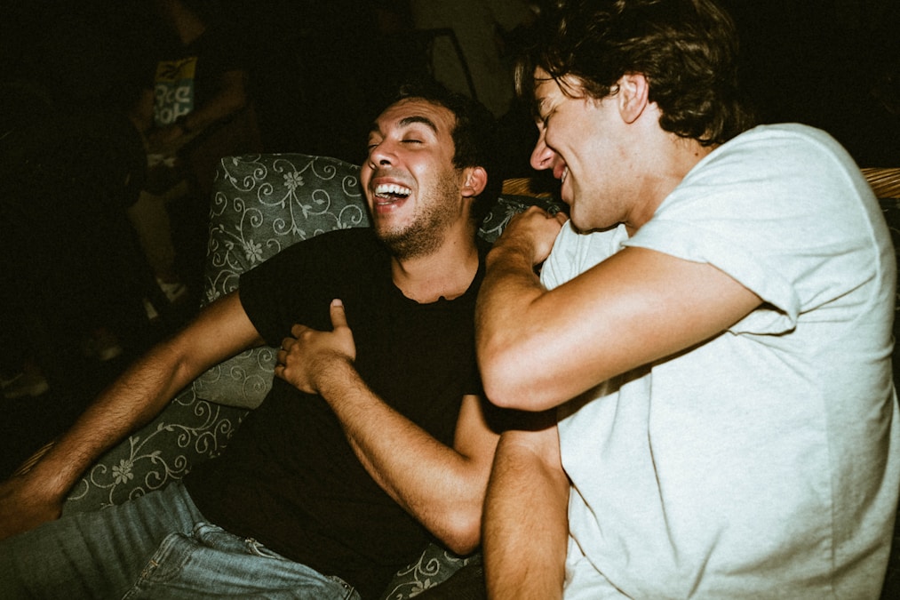 Three roommates relaxing together in a well-furnished apartment living room
