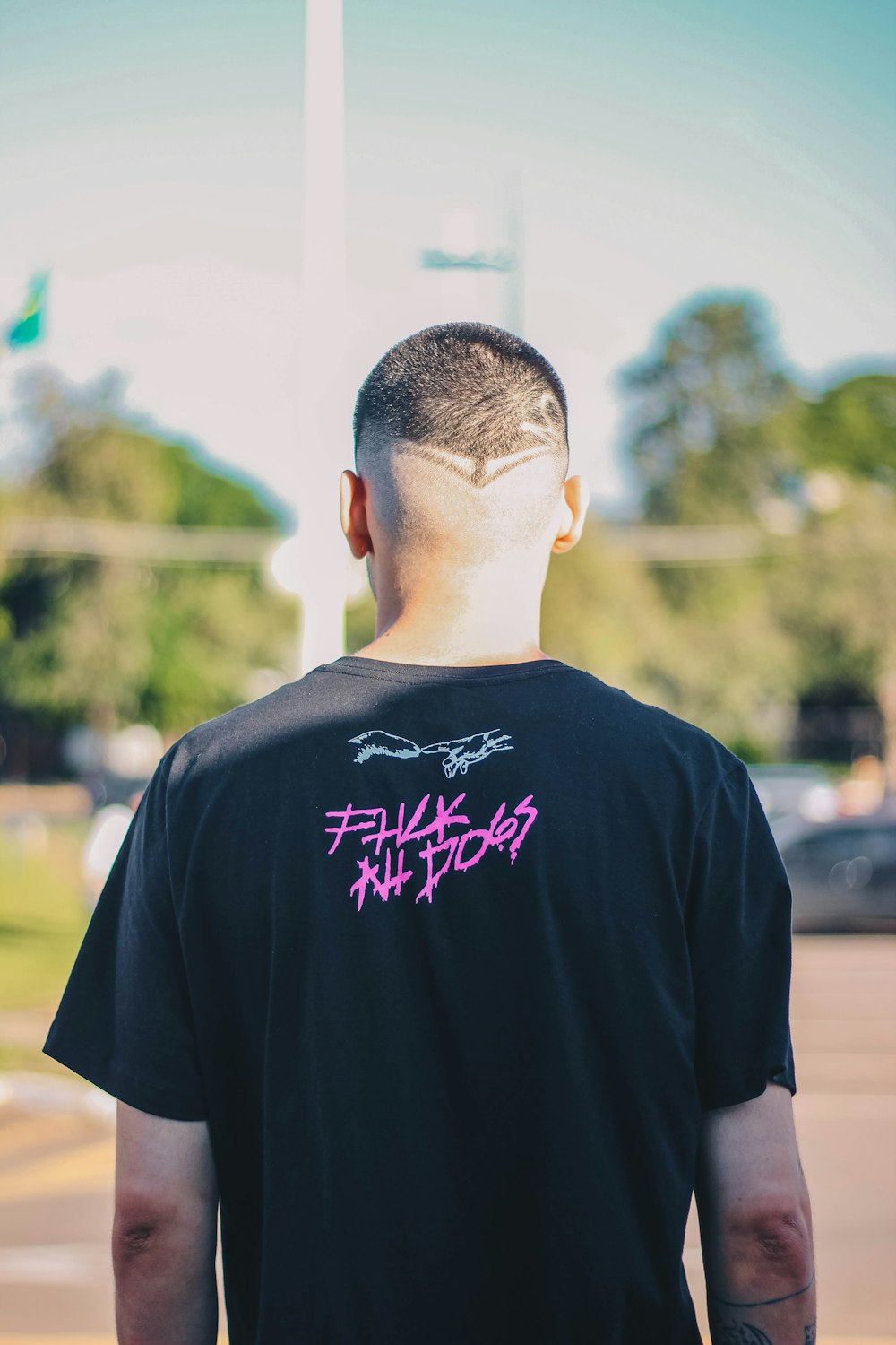 man in black crew neck t-shirt standing during daytime