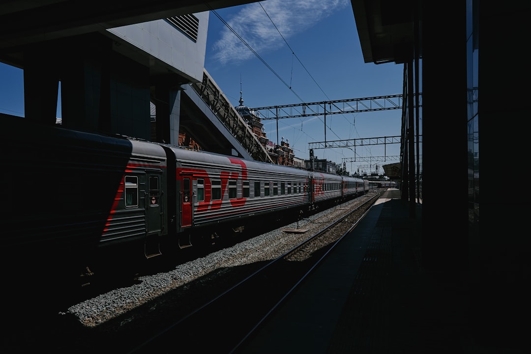 red and white train on train station during daytime