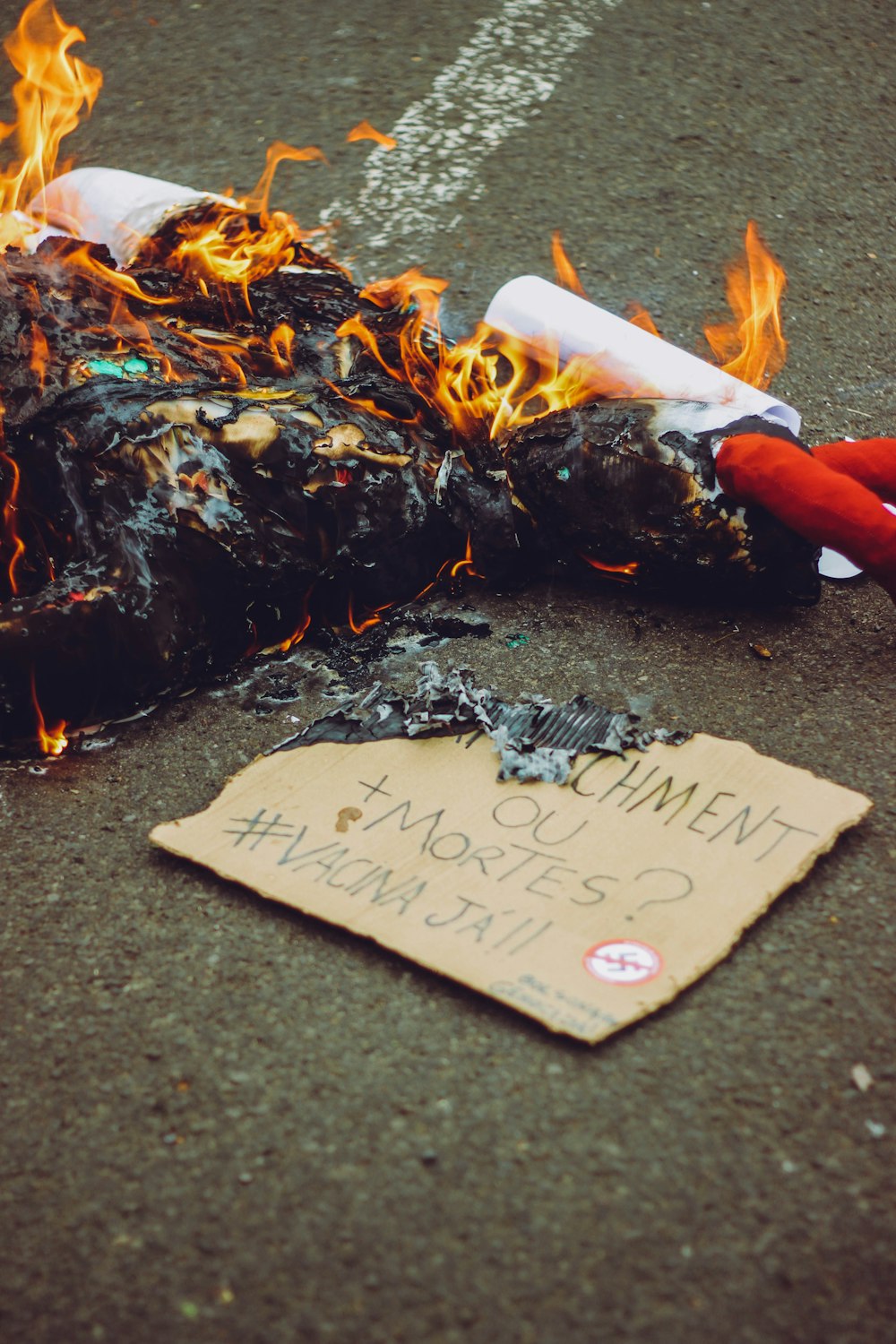 person holding white and orange paper