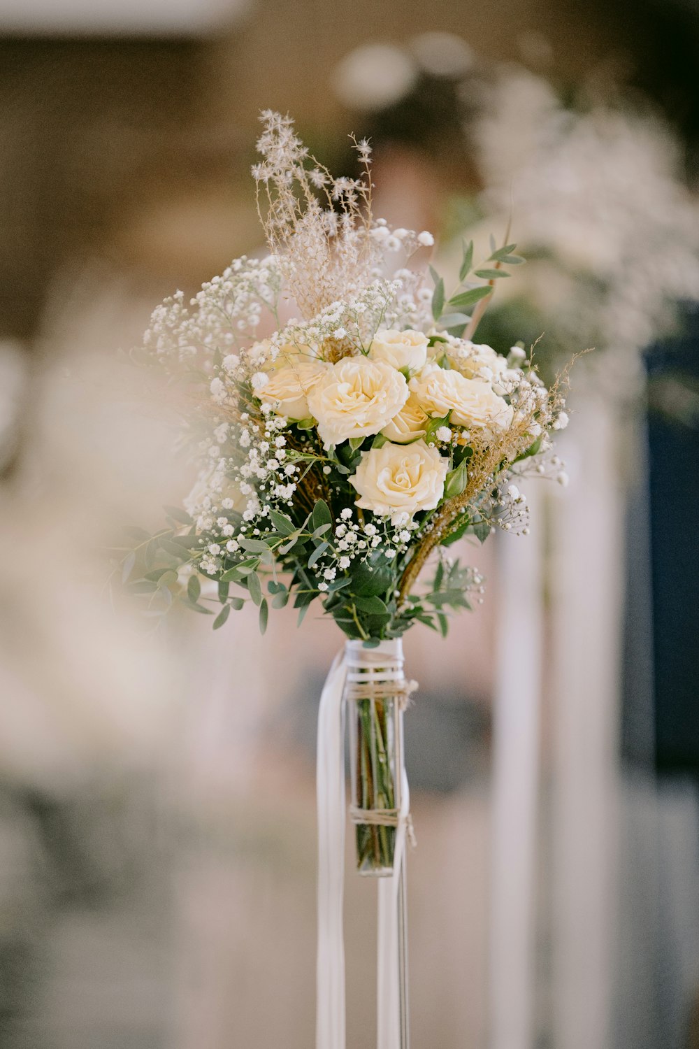 white flowers in clear glass vase