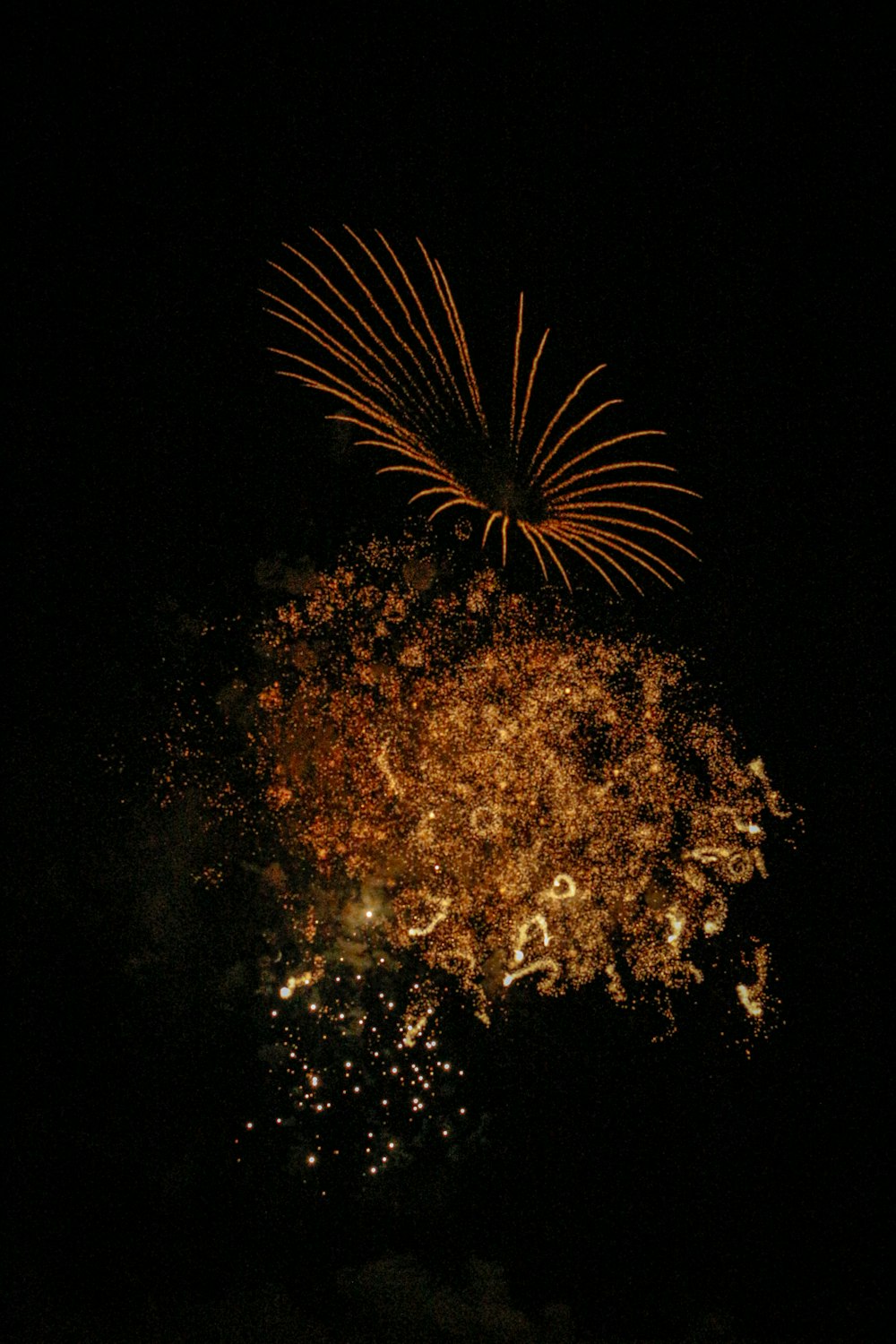 orange fireworks in the sky during night time