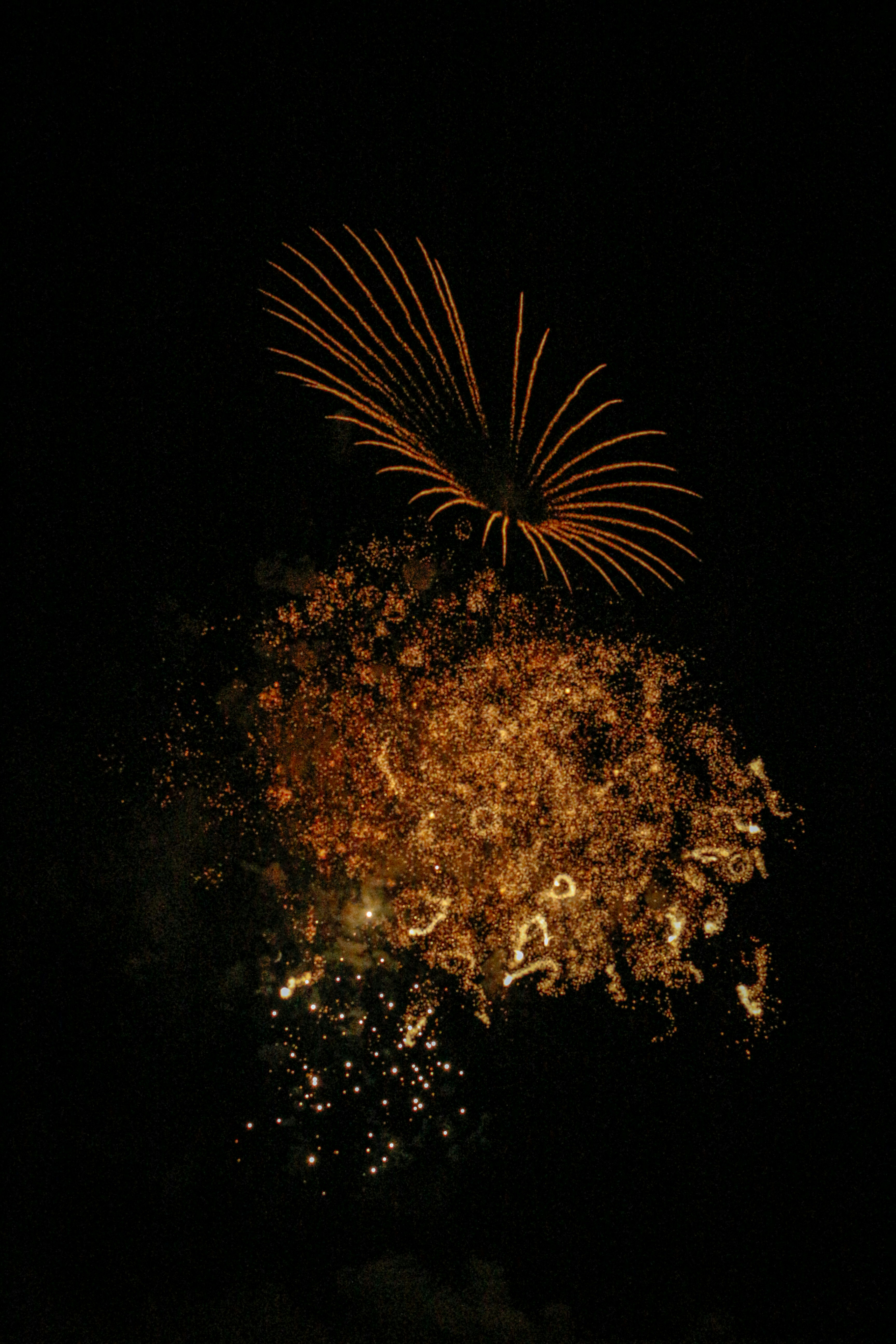 orange fireworks in the sky during night time